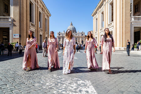 Bachelorette's bride and bridesmaids walking down Via della Conciliazione, Vatican, Rome