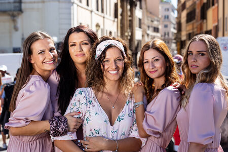 A lovely closeup portrait of bride and bridesmaids all together on Sant'Angelo Bridge, during a bachelorette photo session in Rome