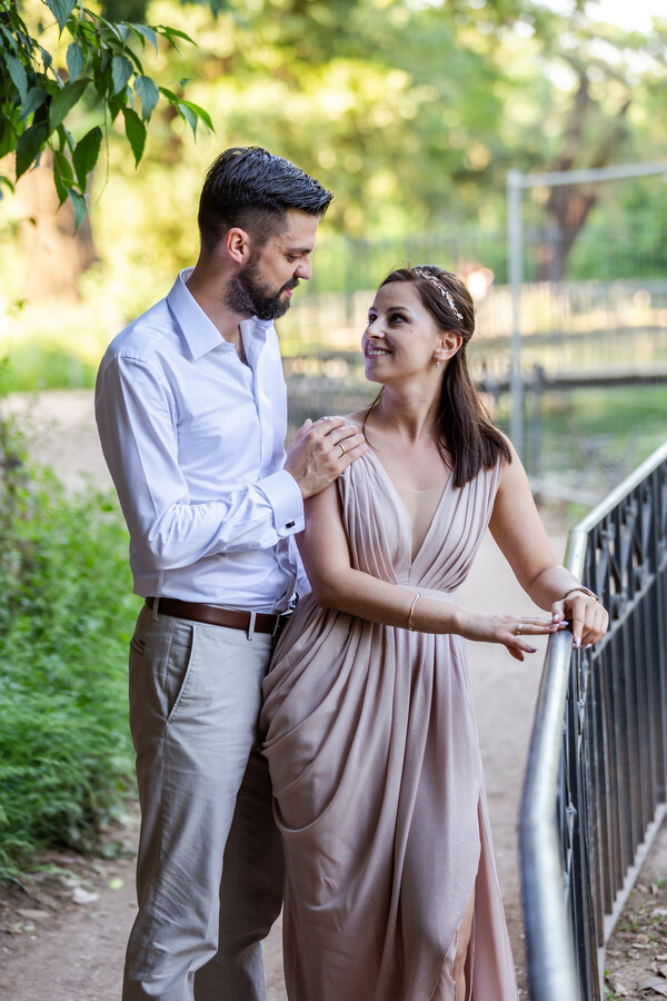 Elegant couple in Villa Borghese celebrating their honeymoon with a romantic photo session in Rome, Italy.