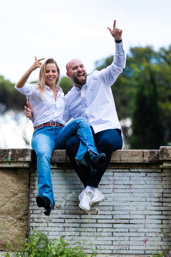 Cheering couple celebrating their engagement in Rome