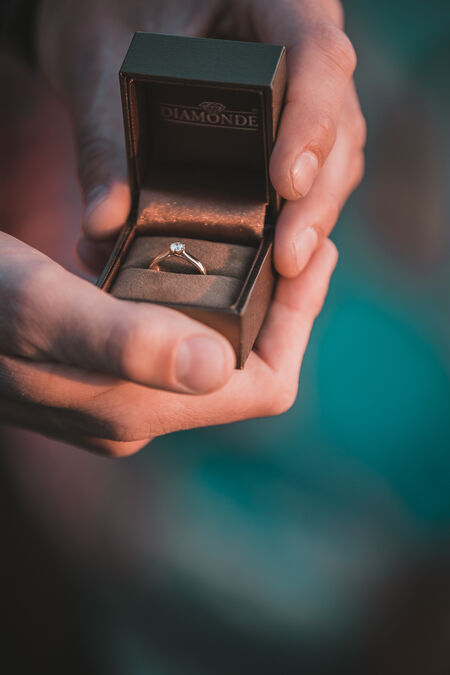 Engagement ring in the warm sunlight of a beautiful sunset