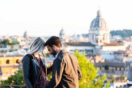 Romantic couple at the Pincio Gardens during their wedding proposal photo session in Rome