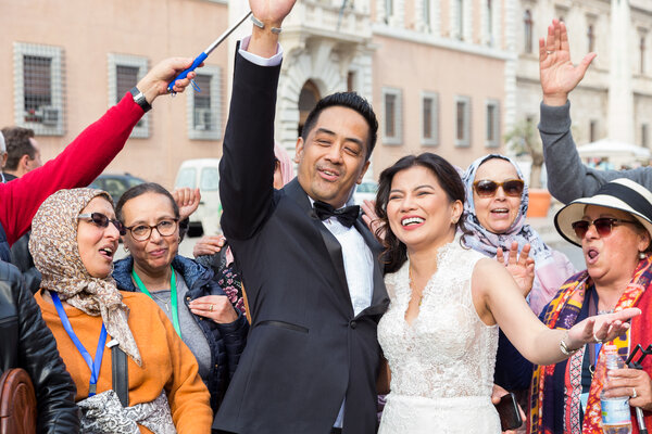 Newly-wed Sposi Novelli celebrating with crowd in Via della Conciliazione, Rome