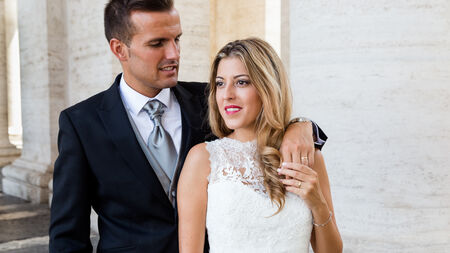 A close-up shot of a Sposi Novelli couple during a wedding photo shoot in St Peter's Square