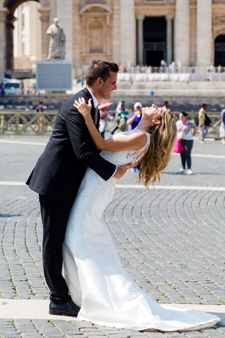 Sposi Novelli Bride and Groom dancing and having fun in St Peter's Square