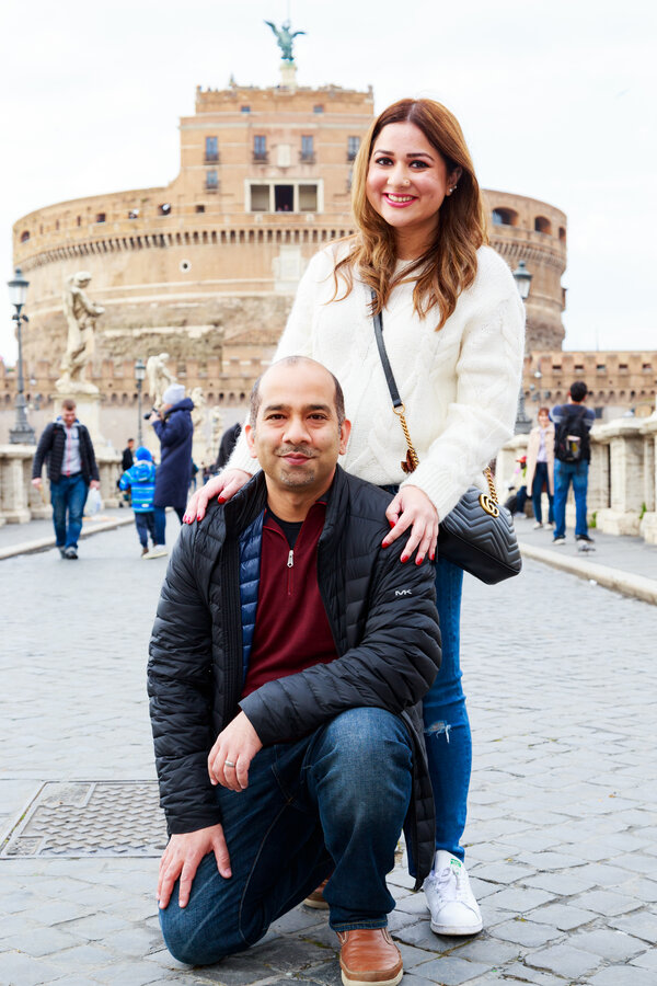Happy couple on Castel Sant'Angelo Bridge during a Family Photo Shoot in Rome