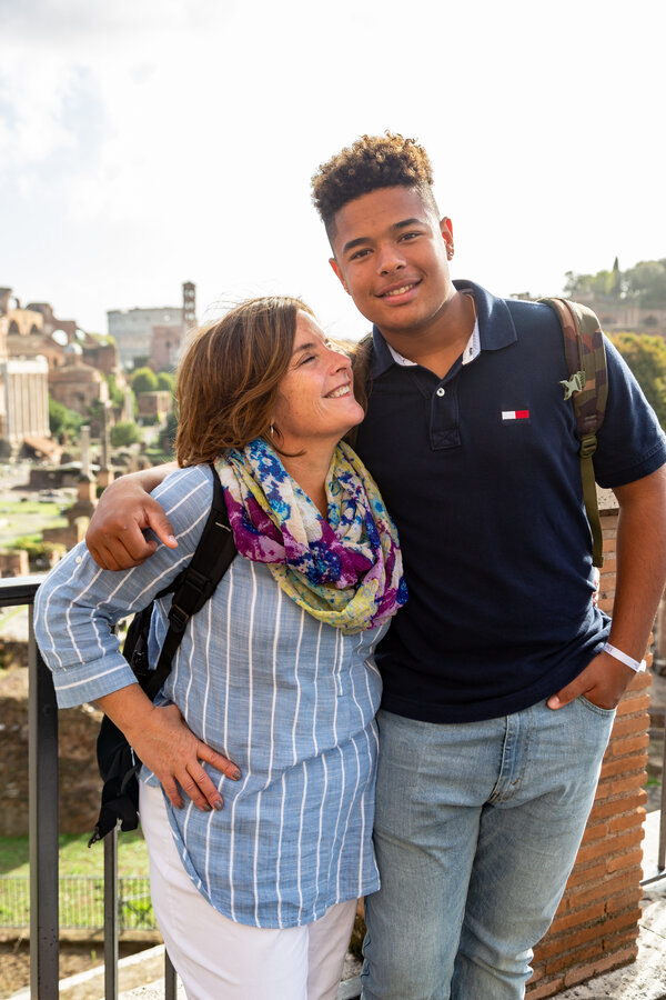 Mother and son smiling during a vacation photo shoot at the Forum Overlook in Rome