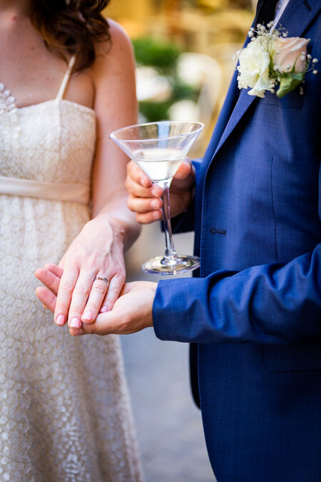Groom holding the bride's hand during their wedding photo shoot in Bracciano
