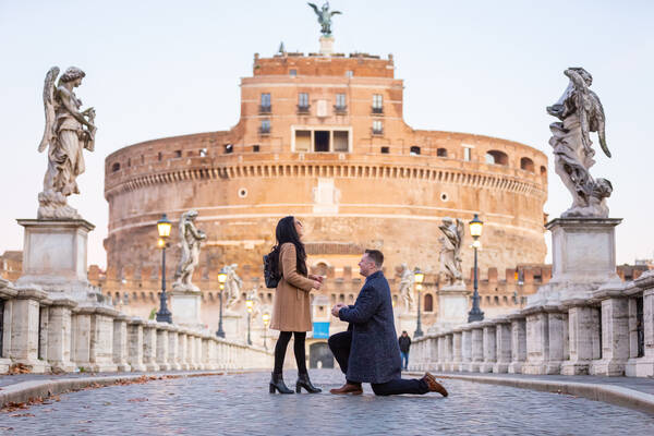 Surprise Proposal in Rome on Castel Sant'Angelo Bridge at sunrise
