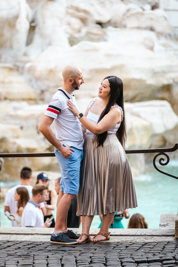 Newly-engaged couple during their early Engagement photo session at the Trevi Fountain