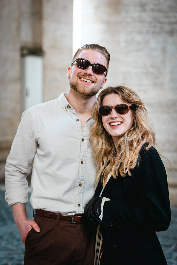 Happy newly-engaged couple in Saint Peter's Square during their engagement photoshoot in Rome
