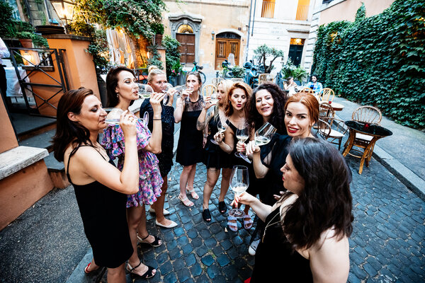 Bridesmaids drinking during their bachelorette party in Rome