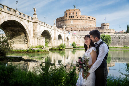 A portrait of the newly-wed couple with Castel Sant'Angelo in the background