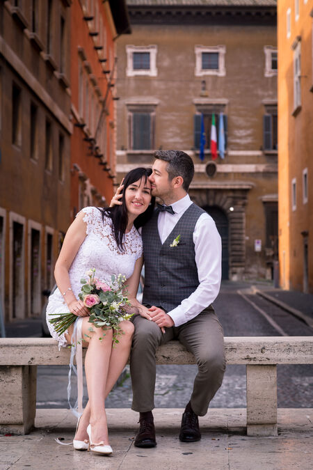 Wedding couple Relaxing on a bench in Via della Conciliazione in Rome