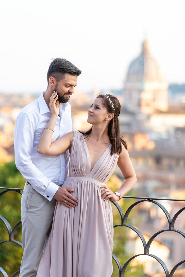 Couple posing during their Honeymoon photo session, at the Belvedere of the Pincio Gardens in Rome.
