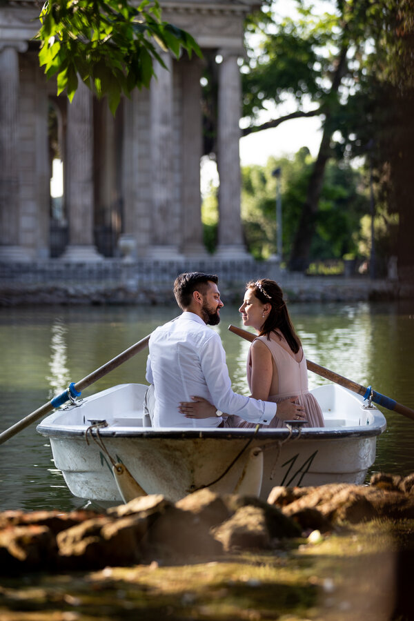 Beautiful couple, kissed by the golden-hour sun, at the Temple of Esculapio, during a post-wedding photo shoot in Villa Borghese, Rome.