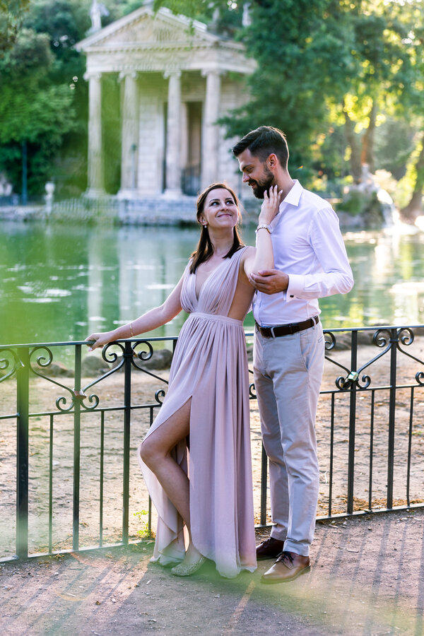 Romantic couple at the Temple of Esculapio, during a their Honeymoon Photo Session in Rome, Italy
