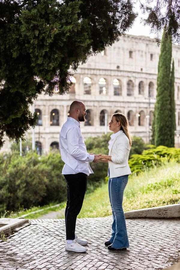 Couple during their surprise proposal photo session on the Oppian Hill in Rome