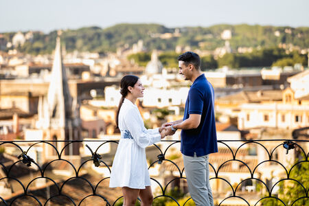 Couple during their declaration of love on the Terrazza Belvedere early morning in Rome
