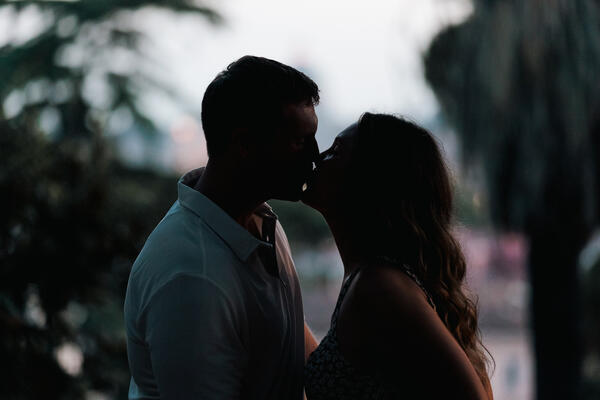Silhouette of newly-engaged couple kissing each other at the Pincio Gardens after sunset.
