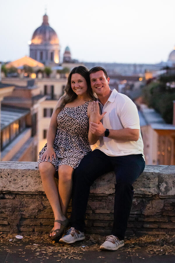 Newly-engaged couple after sunset in Rome