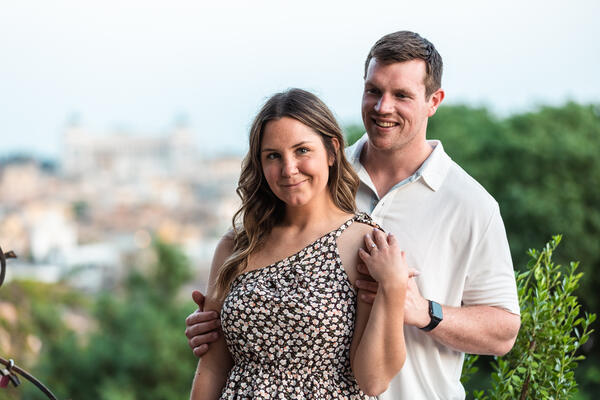 Happy couple posing during their surprise proposal photo shoot on the Pincian Hill in Rome
