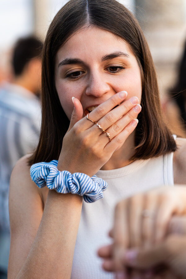 Close-up of a surprised newly-engaged fiancé after saying yes during her proposal photo session in Rome