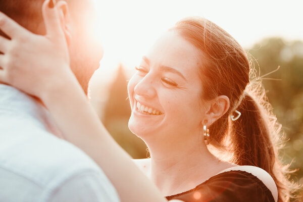 Happy couple during their proposal at sunset at the Pincio Gardens in Rome