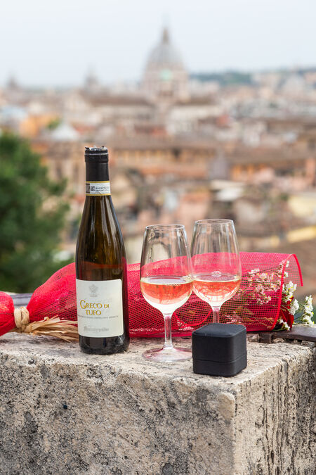 Detail of white wine during a surprise proposal photo shoot in Rome on the Terrazza Belvedere at the Pincio Gardens