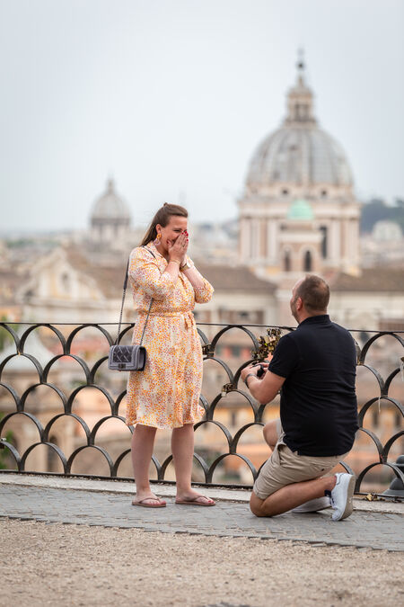 Couple during a Surprise Proposal Photo shoot at the Terrazza Belvedere at the Pincio Gardens in Rome