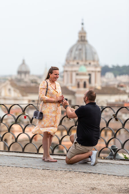 Couple during a secret proposal photo session at the Terrazza Belvedere at the Pincio Gardens in Rome