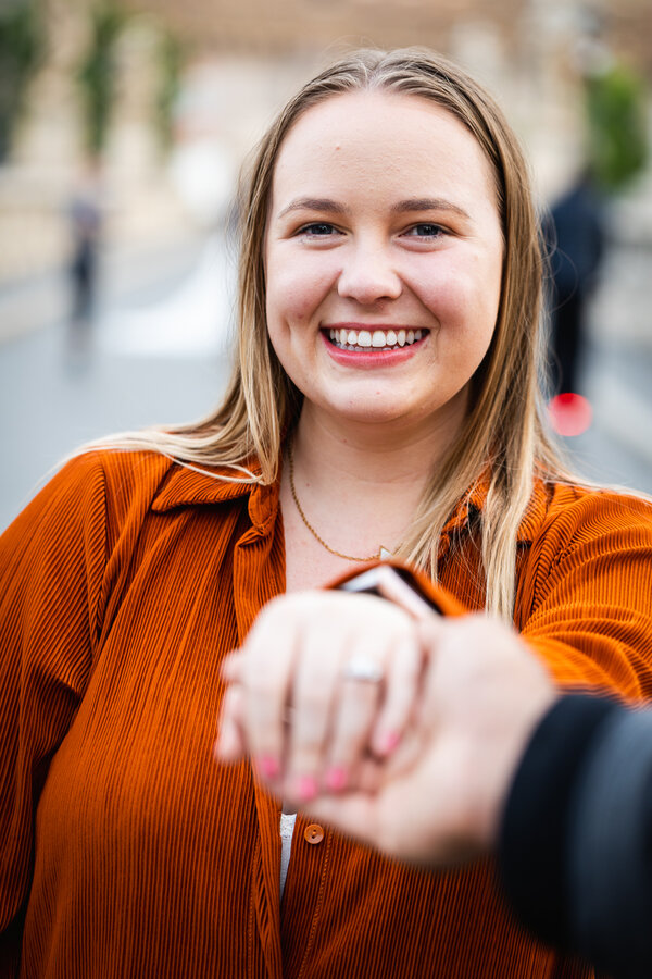 Fiancée smiling and being happy during her wedding proposal photo session in Rome