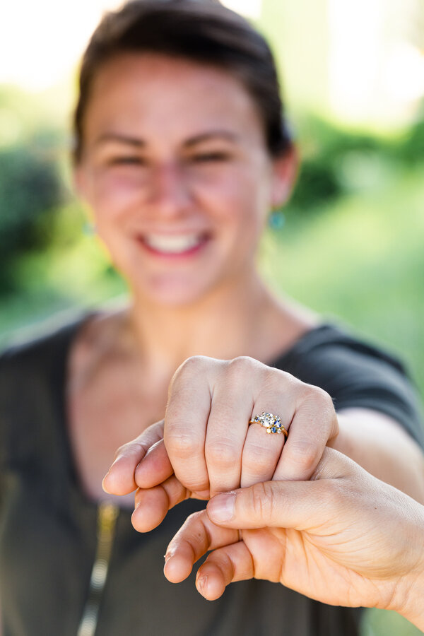Fiancée showing off her beautiful engagement ring during a surprise proposal photoshoot in Rome