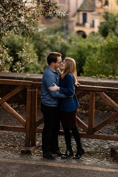 Couple holding each other during their engagement photo session in Rome