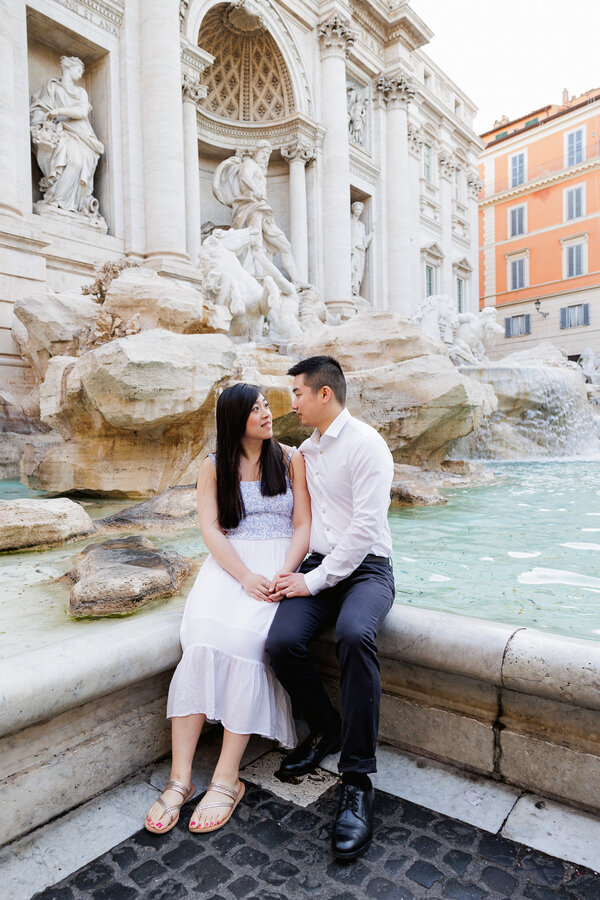Couple at the Trevi Fountain during a romantic photoshoot in Rome