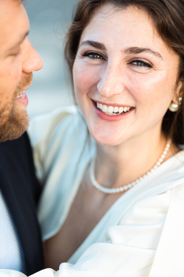 Beautiful newly-engaged woman smiling during her engagement photo session in Rome