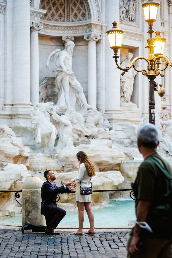 Surprise wedding proposal at the Trevi Fountain early in the morning