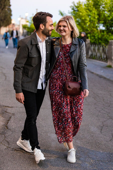 Newly-engaged couple walking together happily