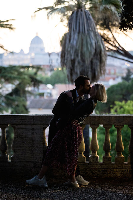Newly-engaged couple dip-kissing with the Vatican in the background