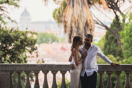 Newly-engaged couple at the Pincio Gardens during their surprise proposal photo shoot in Rome