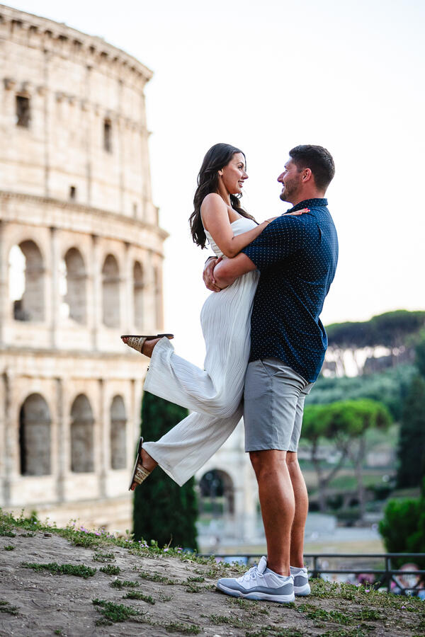 Happy Newly-engaged couple at the Giardinetto del Monte Oppio during their suprise proposal photoshoot in Rome
