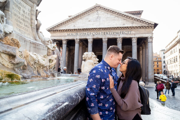 Couple holding each other in Piazza della Rotonda, with the Pantheon in the background