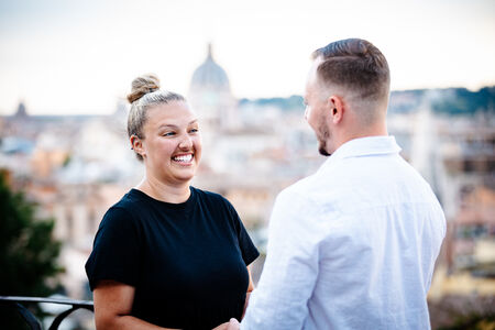 Beautiful couple at the Terrazza Belvedere moments away from their surprise marriage proposal in Rome