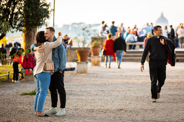 Couple hugging each other at the Orange Garden during their proposal photo session in Rome