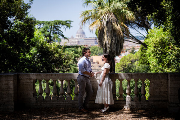 Newly-engaged couple at the Pincio Gardens with the Vatican in the background