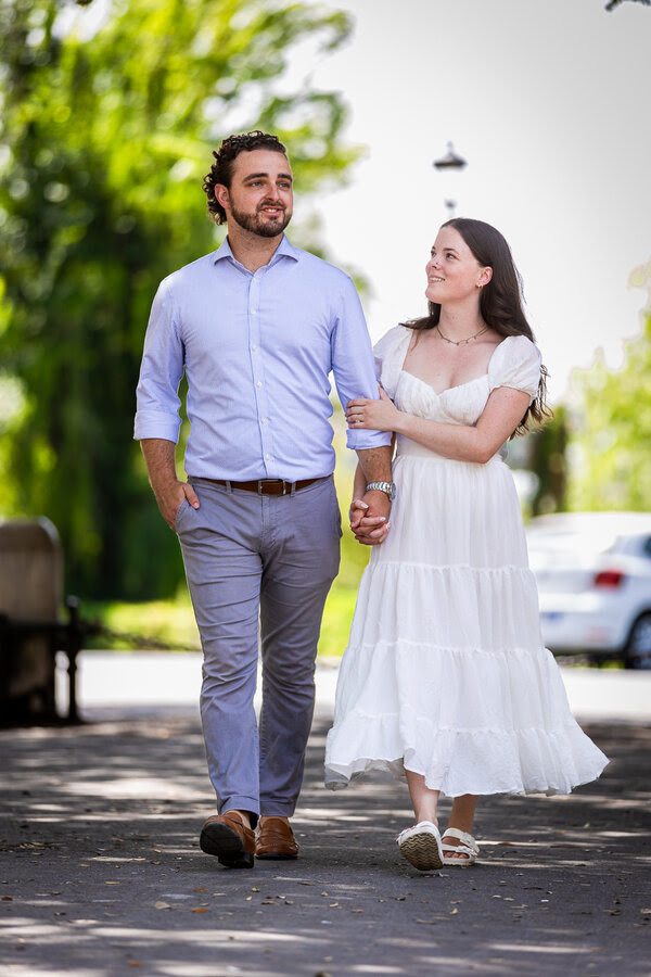 Newly-engaged couple walking at the Pincio Gardens in Rome