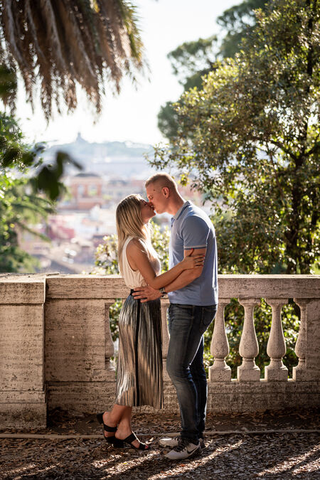 Romantic portrait of a newly-engaged couple at the Pincio Gardens in Rome