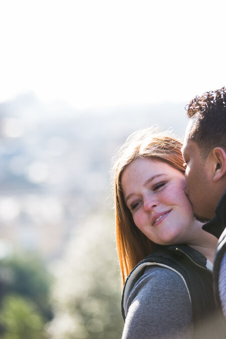 Sweet and tender kiss during a surprise proposal session at the Pincio Gardens, Rome