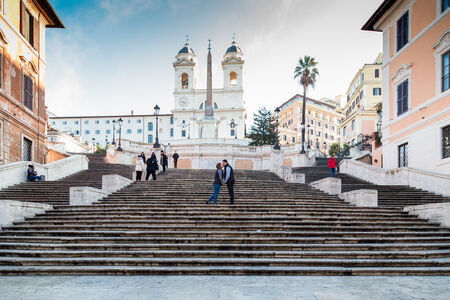 Couple kissing sweetly on the Spanish Steps, Rome