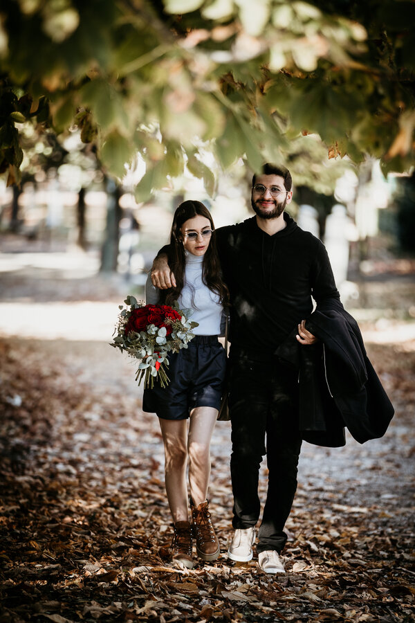 Newly-engaged couple walking at the Pincio Gardens during their engagement photoshoot in Rome